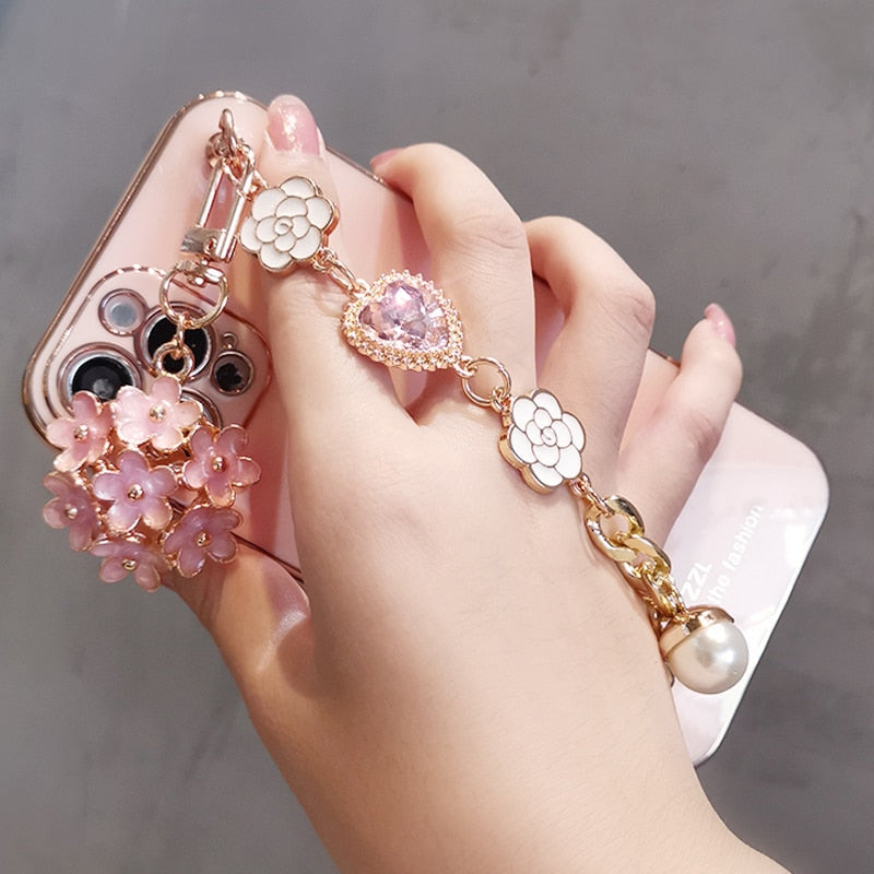 Funda para teléfono con colgante de gemas y flores