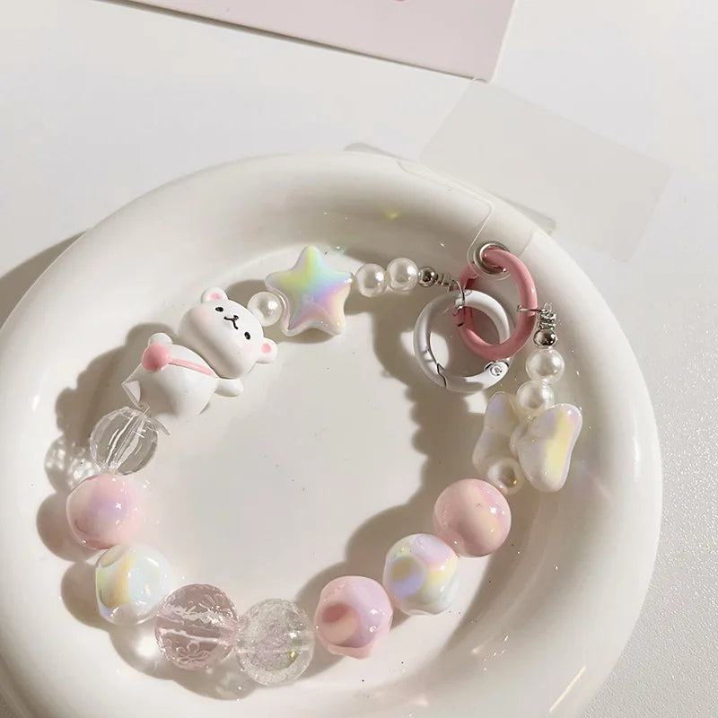 Lanière de téléphone perlée avec pendentif ours