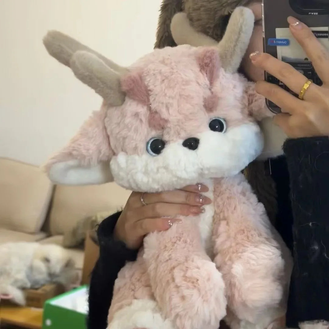 Peluche de dragón rosa con astas