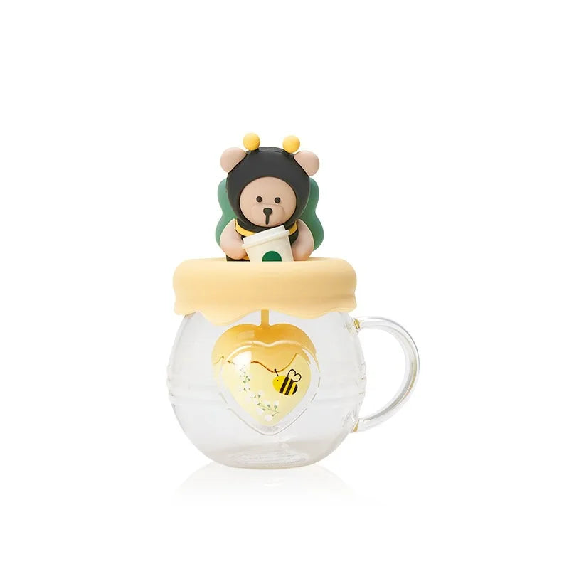 Taza infusora de té con forma de abeja y miel