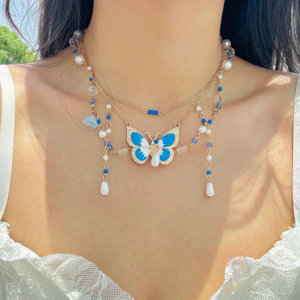 Collier multicouche en perles d'imitation papillon