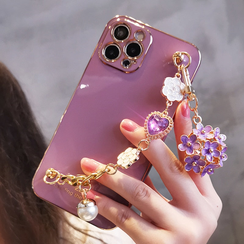 Funda para teléfono con colgante de gemas y flores
