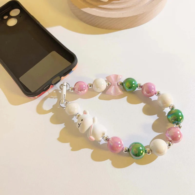 Lanière de téléphone perlée avec pendentif ours