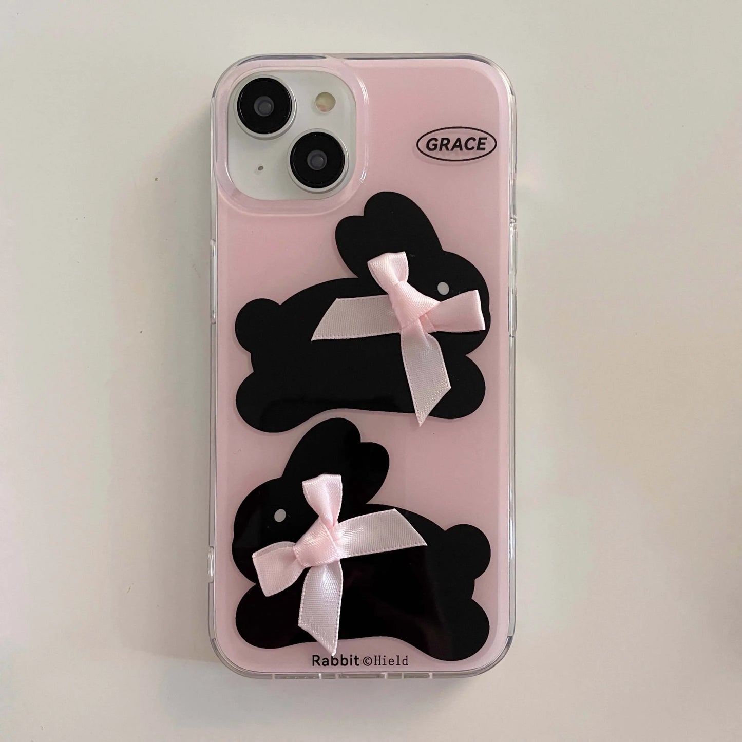 Coque iPhone avec nœud rose et lapin noir
