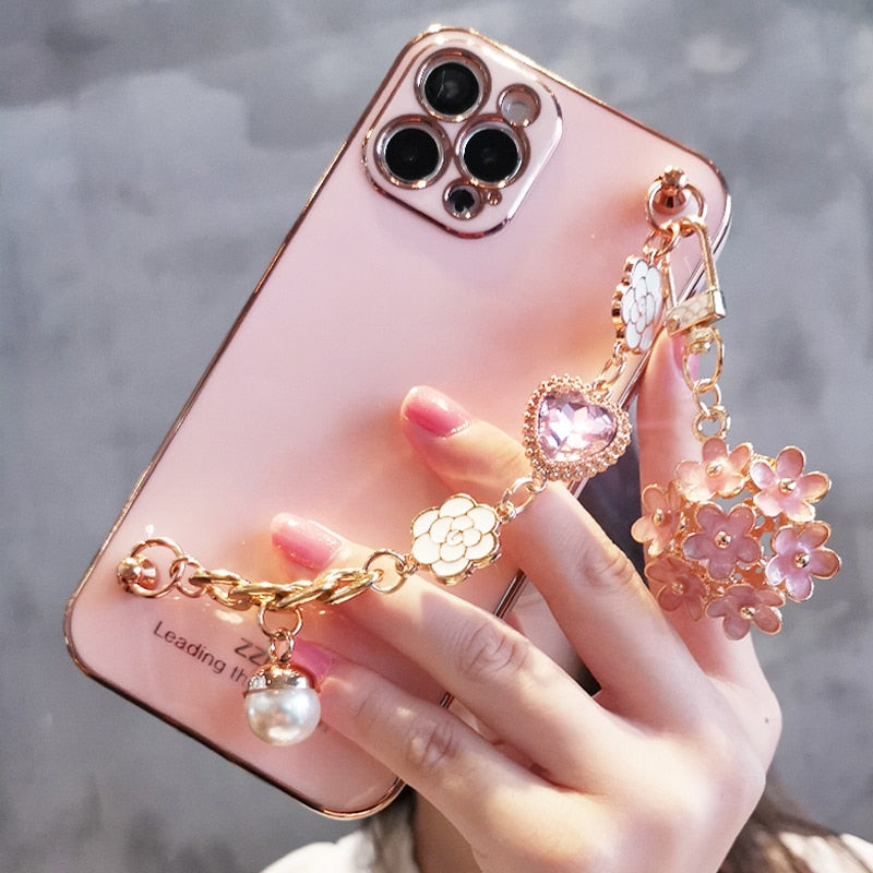 Funda para teléfono con colgante de gemas y flores