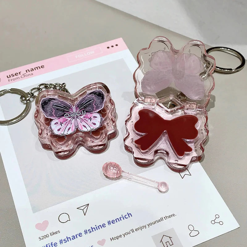 Porte-clés brillant à lèvres papillon