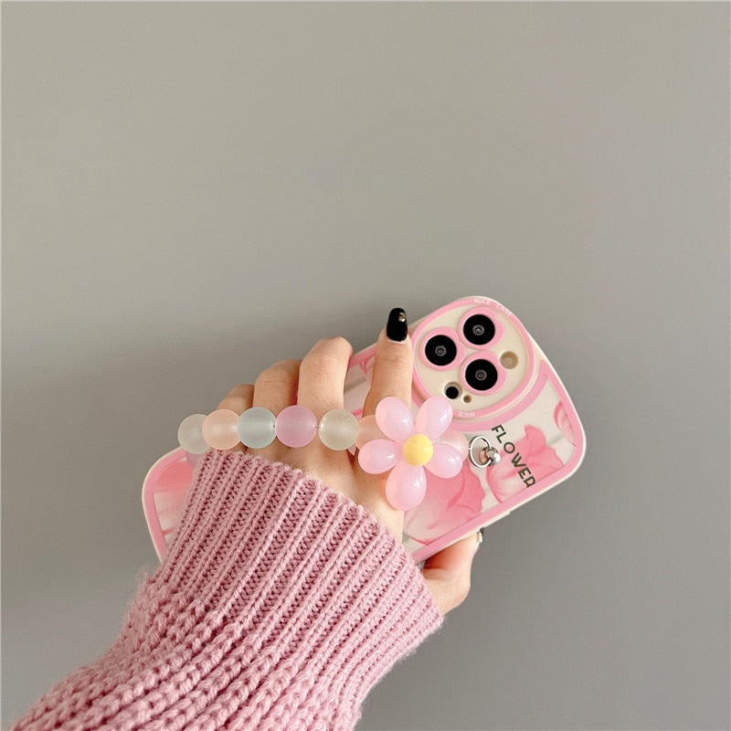 Funda blanda para iPhone con diseño de flores y cadenas