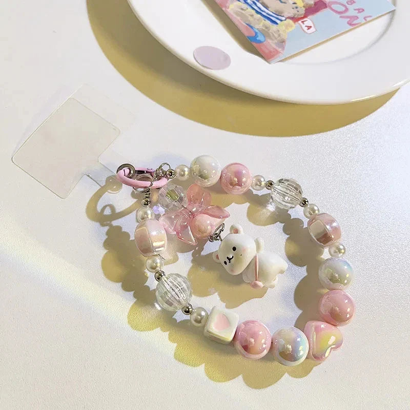 Lanière de téléphone perlée avec pendentif ours