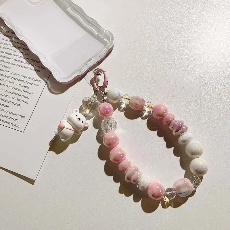 Lanière de téléphone perlée avec pendentif ours