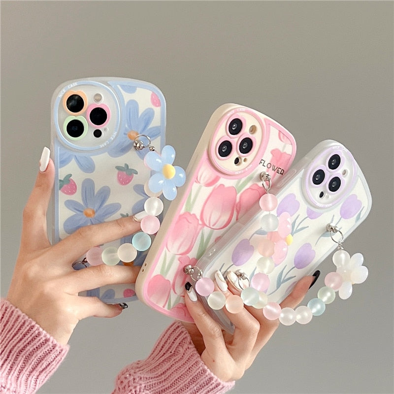 Funda blanda para iPhone con diseño de flores y cadenas