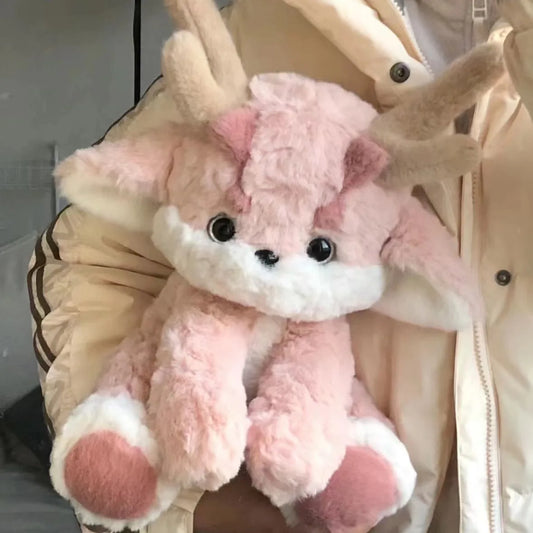 Peluche de dragón rosa con astas