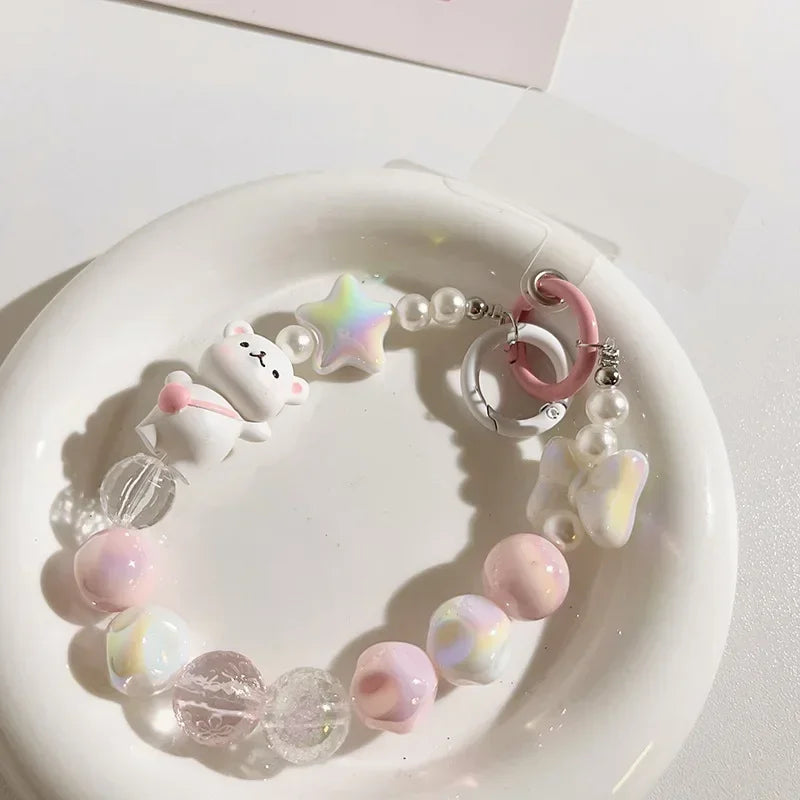 Lanière de téléphone perlée avec pendentif ours