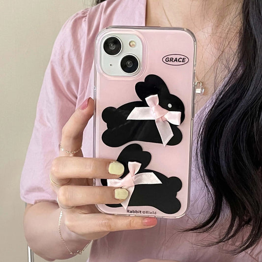 Coque iPhone avec nœud rose et lapin noir