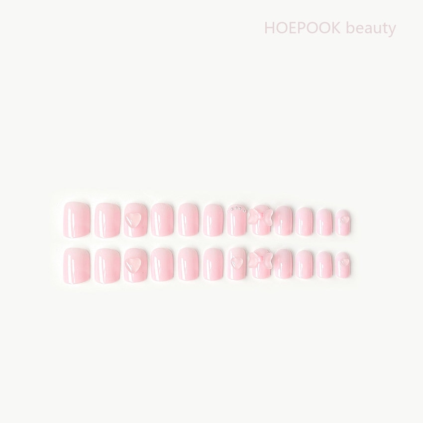 Ongles à coller avec cœur et nœud roses