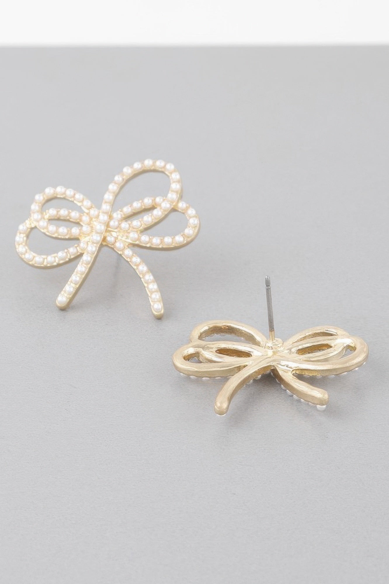 Boucles d'oreilles ruban doublement ornées